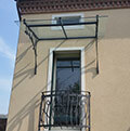 wrought iron projecting roof